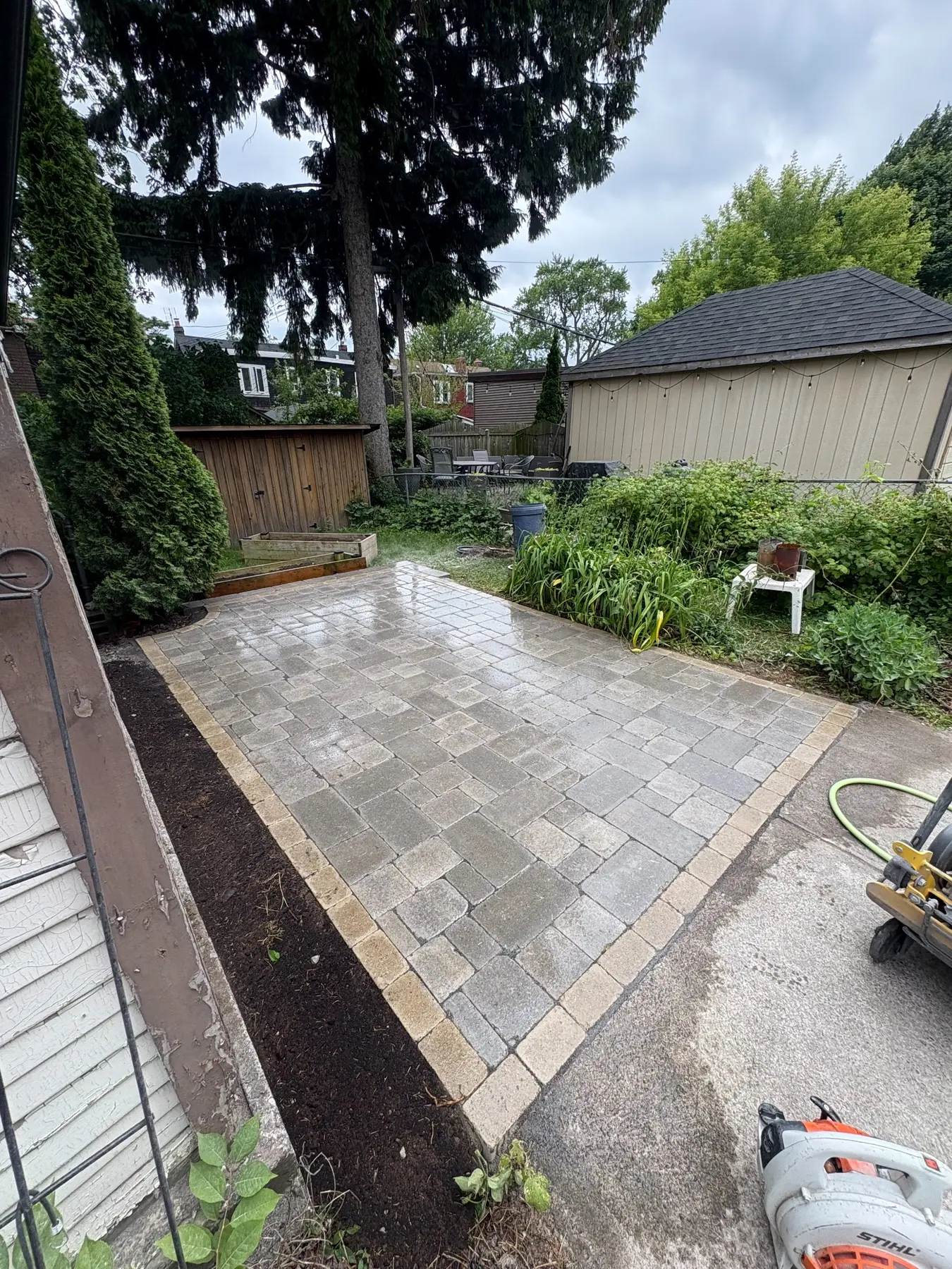 Finished backyard interlock patio in Toronto.