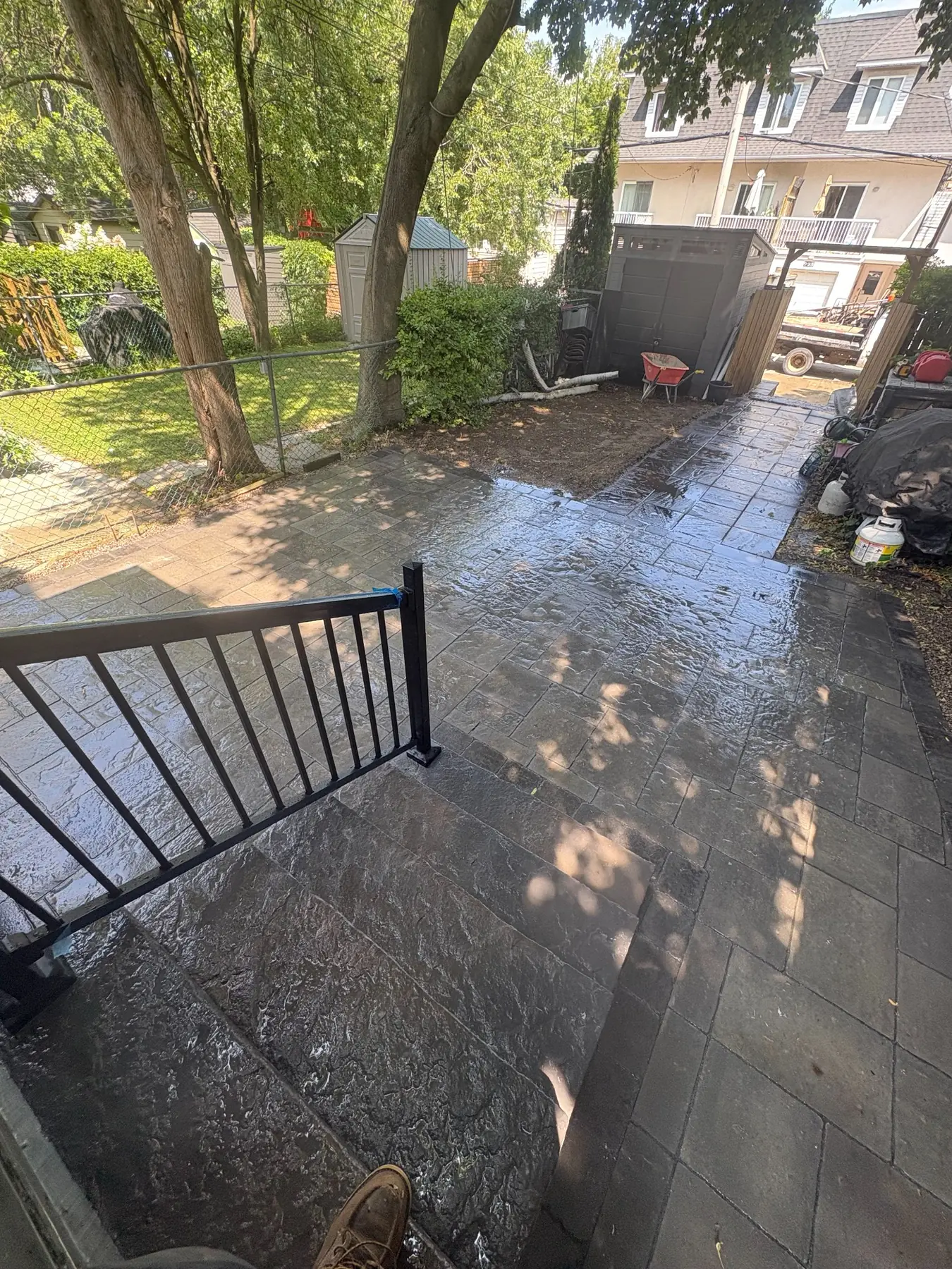 Interlock patio and walkway around a mature Toronto backyard.