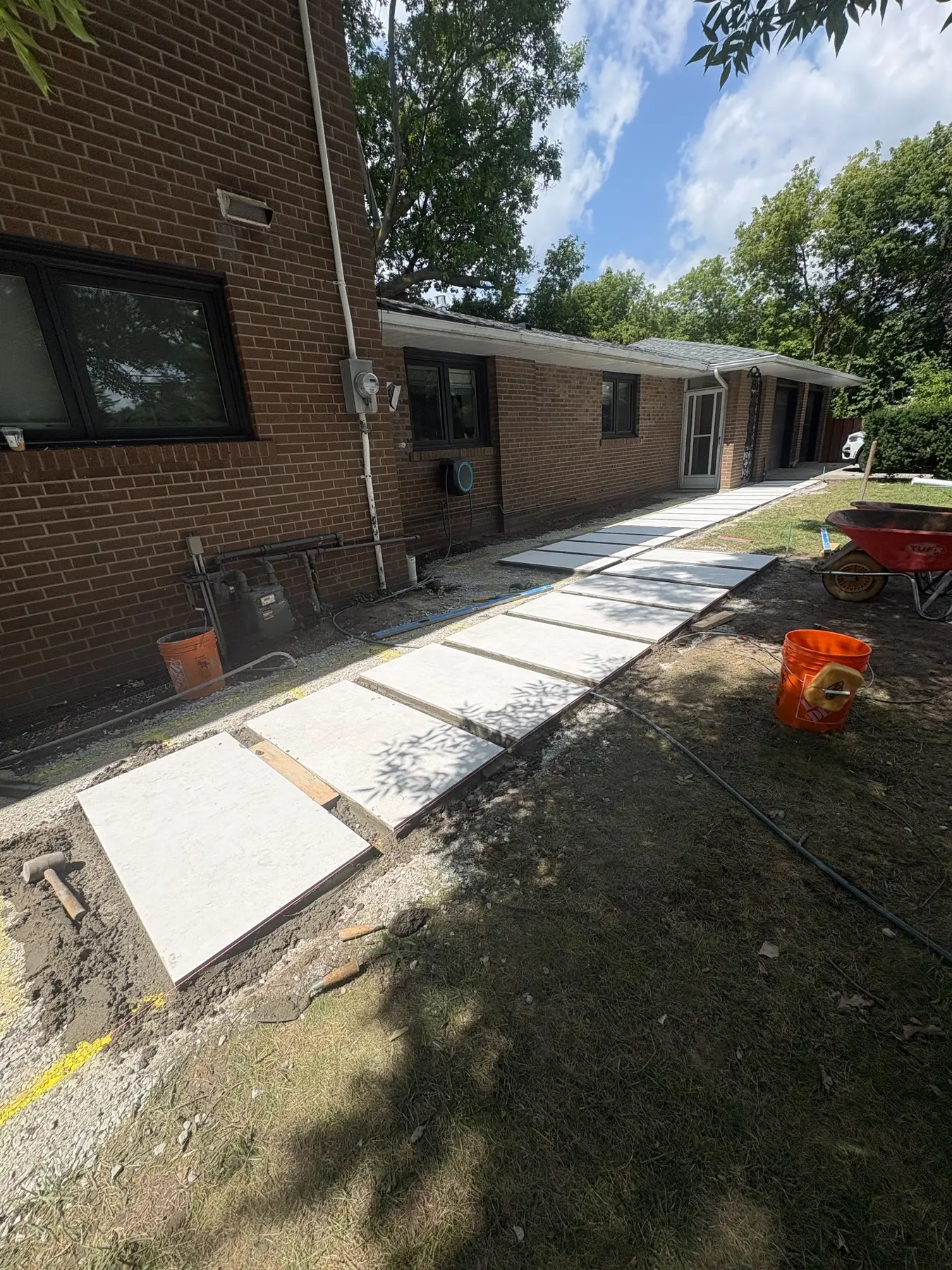 Banas Stone porcelain walkway stepping stones during installation.