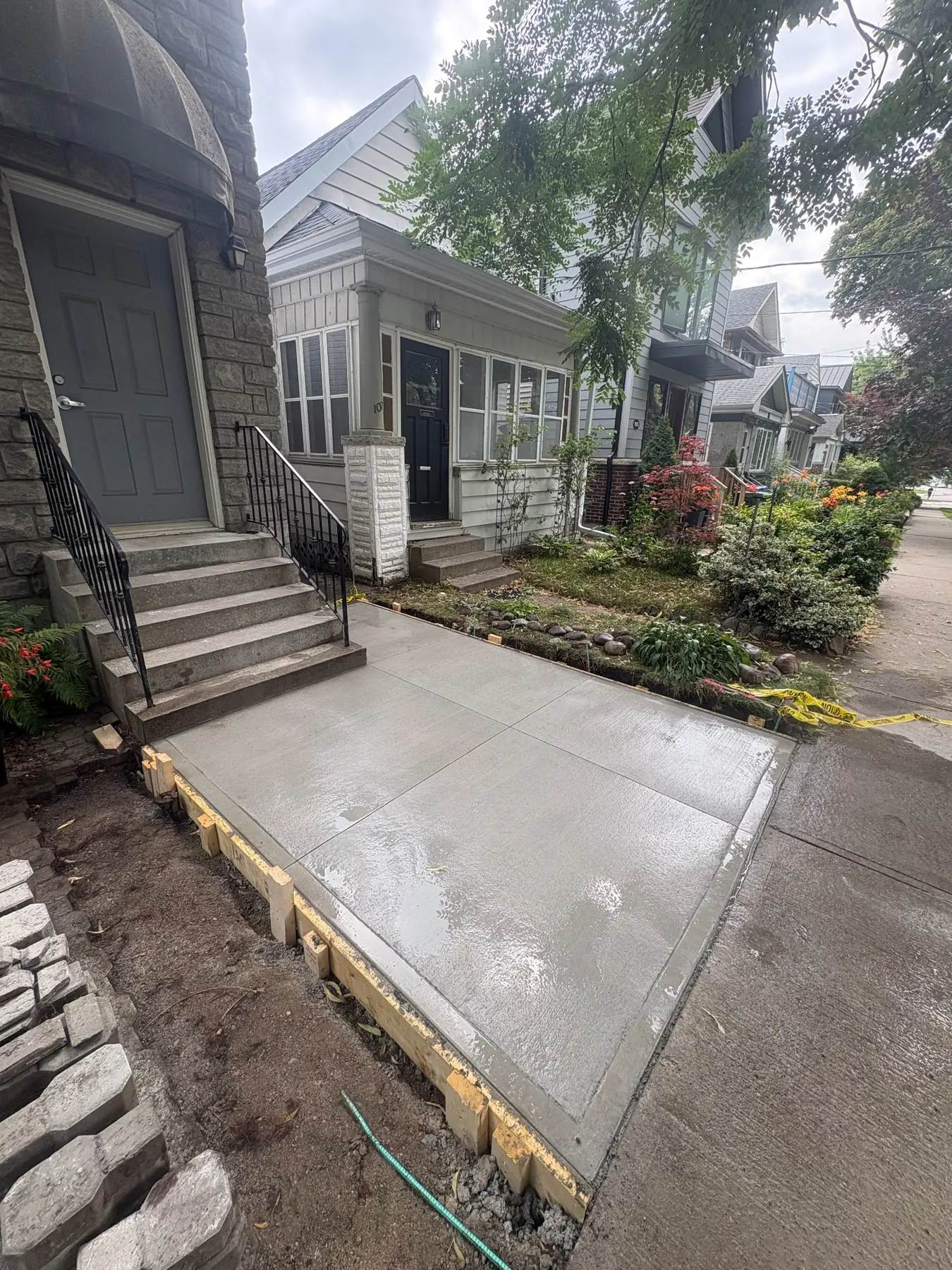 New broom-finished concrete front walkway and landing.