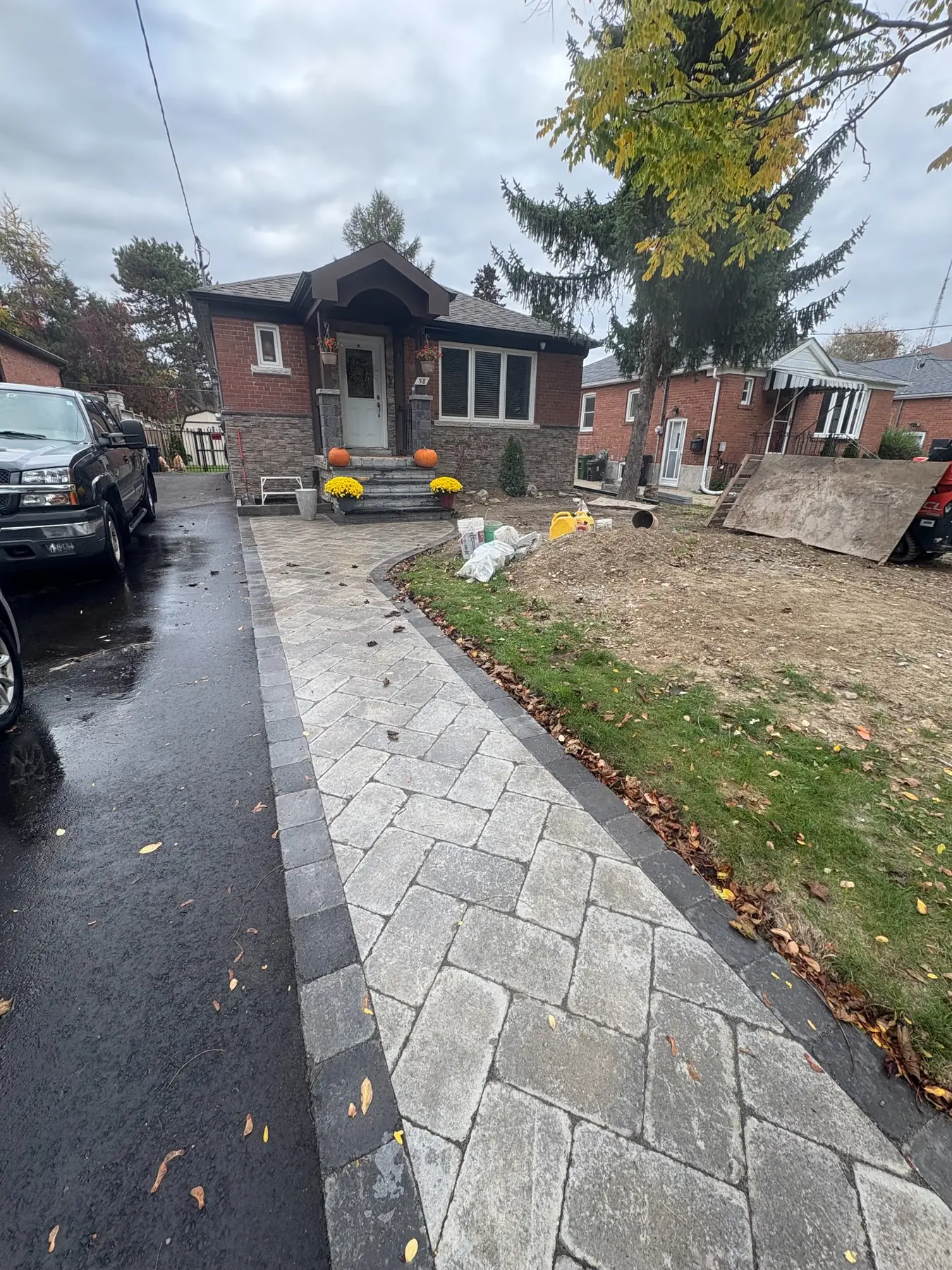 Curved front walkway and entrance landing with contrasting border.