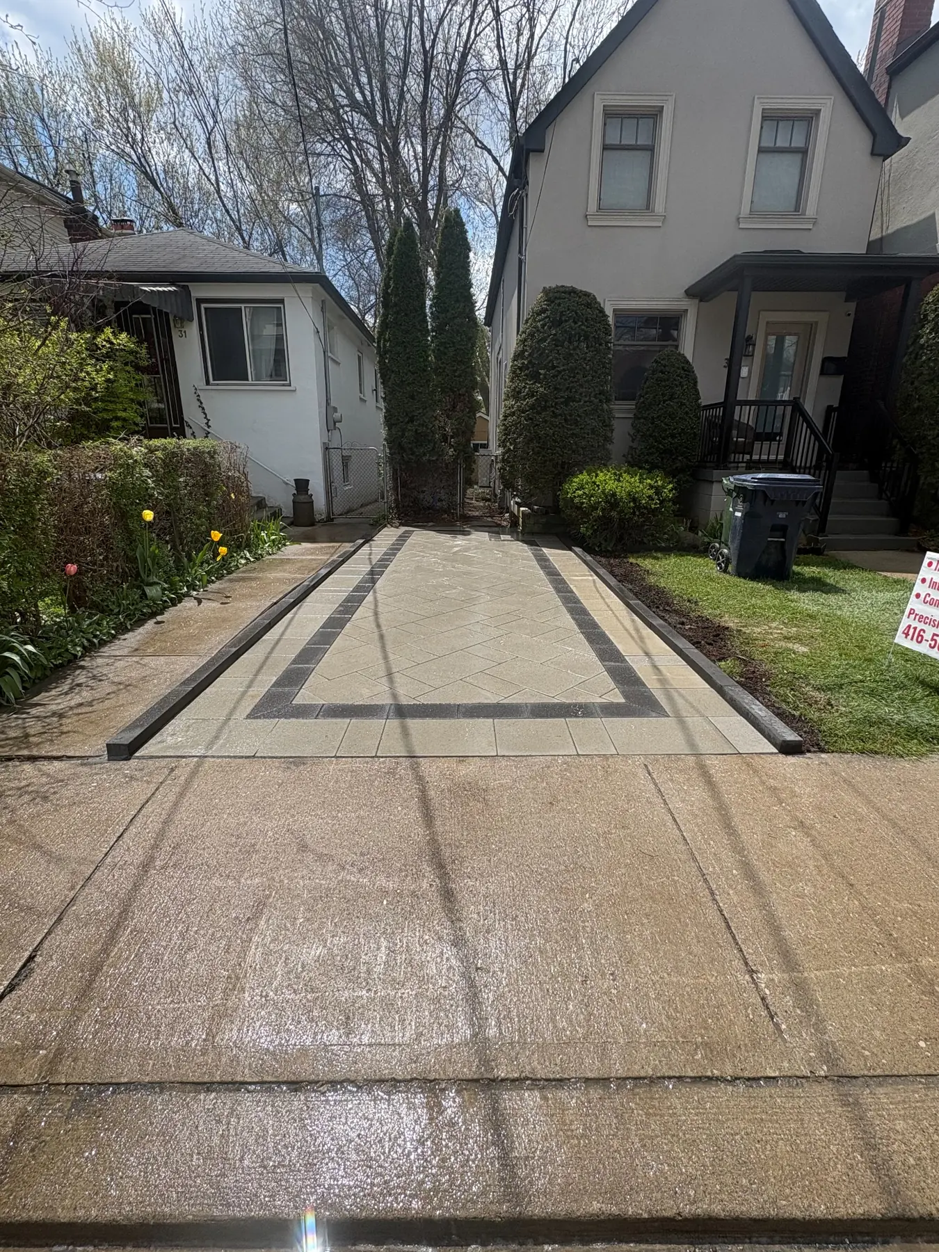 Custom interlock parking pad with charcoal border.