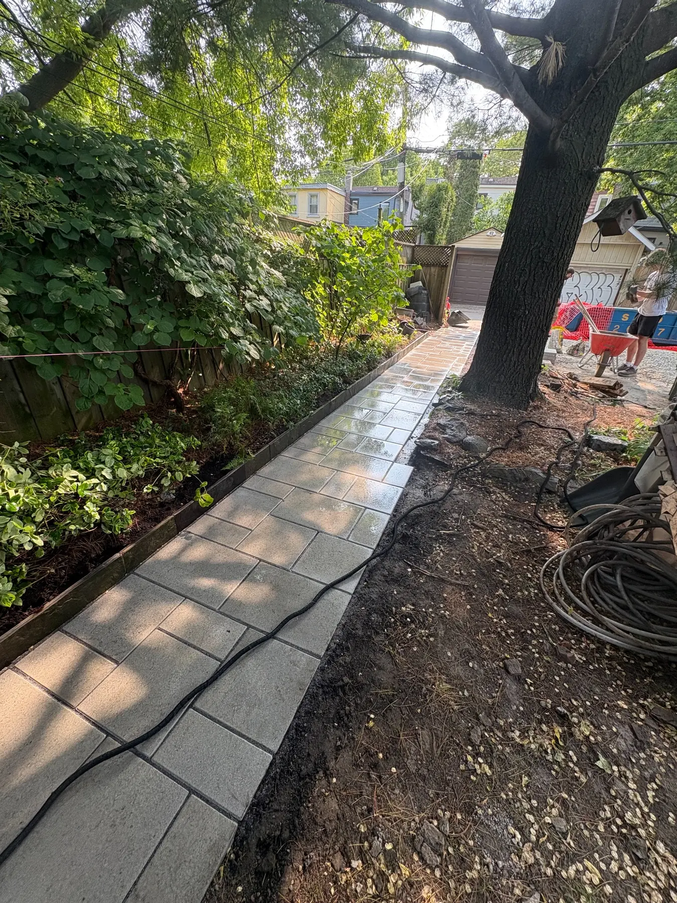 Interlock walkway installation with clean borders on a Toronto property.